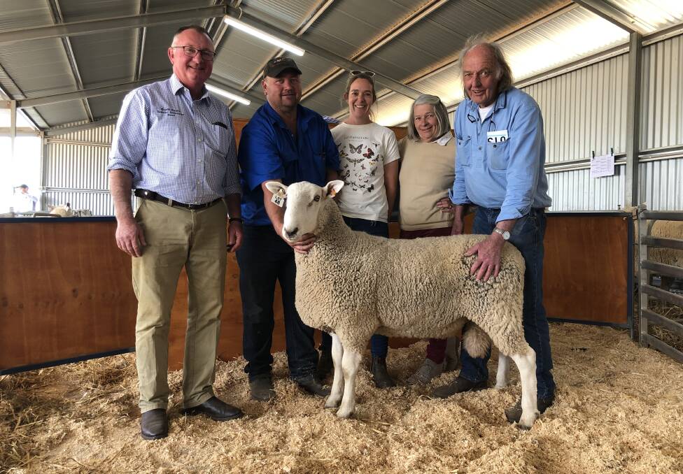 The equal-top priced ram with North South stud principal, Simon Makeham and purchasers, Scott Gibson, Amelia Miller, Julie and Donald McFarlane, Stumpjump, Young. 