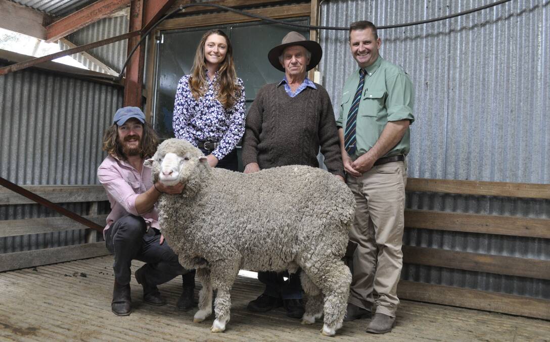 Sam Picker with the ram he donated to the cause, pictured with his partner Avalon McGrath, purchaser of the ram Charlie Chown, Reids Flat and Landmark's Rick Power. Photo: Supplied 
