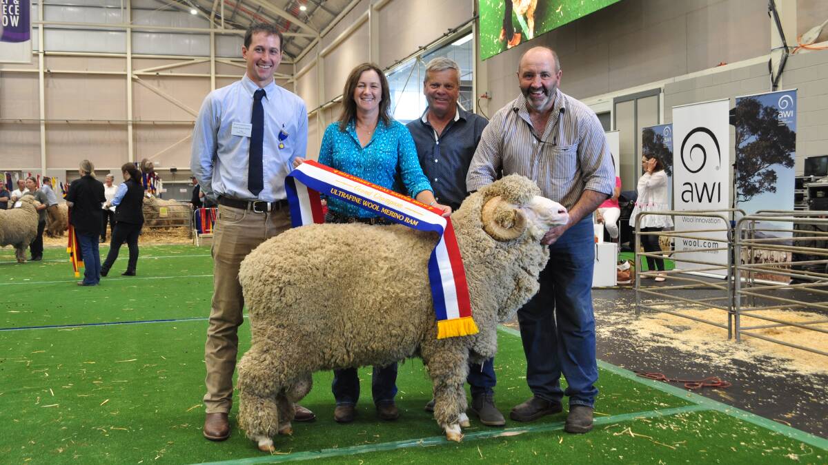 Grand champion ultrafine ram from Conrayn, Berridale shown by Peter and Jayne Lette with judge James Rayner, Pomanara, Sally's Flat and Murray Picker, Hill Creston, Bigga. 