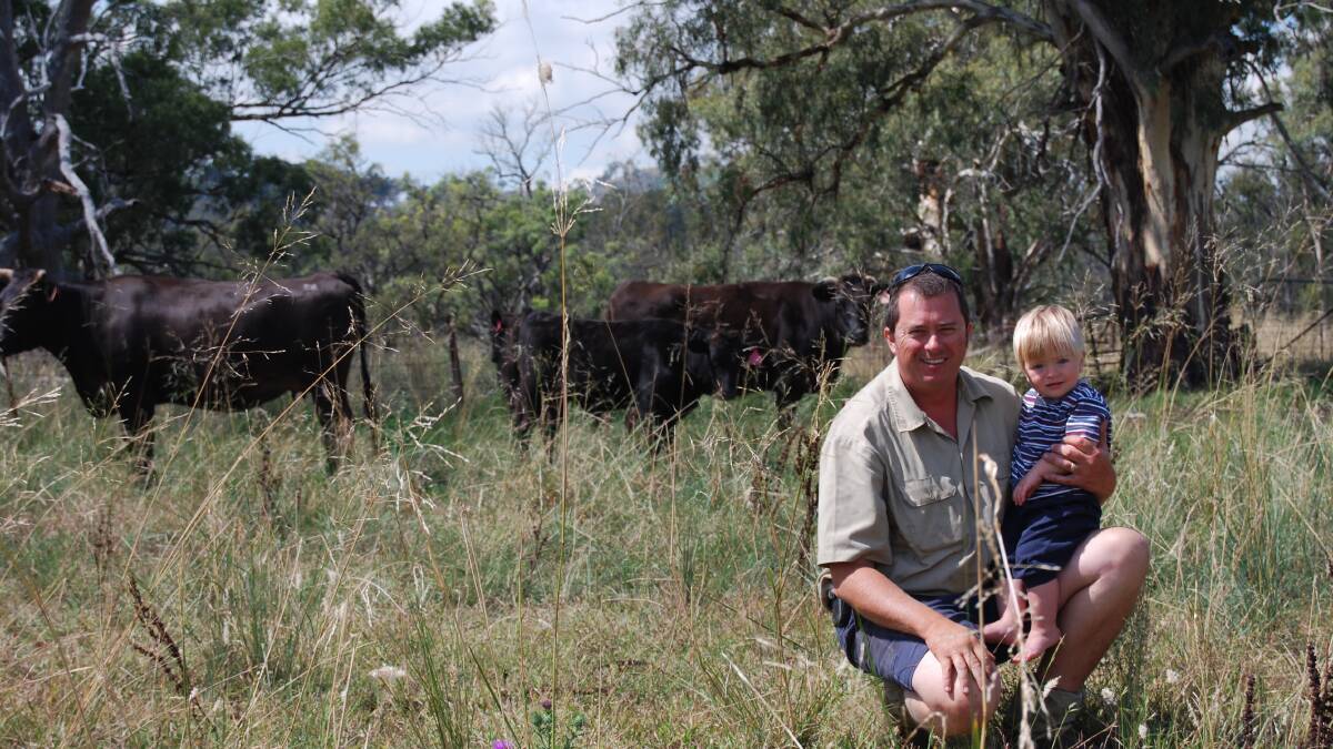 Cowra Wagyu producer, Peter Bishop with his son Alex and some of his Wagyu cattle. Photo: Supplied