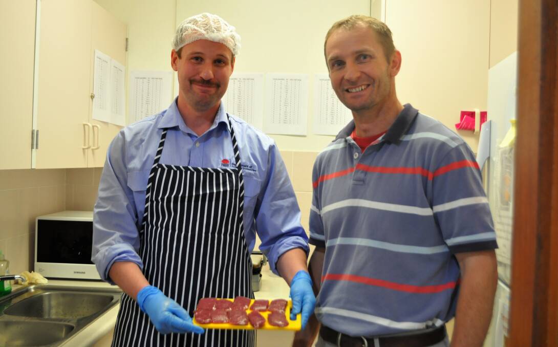 NSW DPI Meat Scientist, Ben Holman prepares the lamb for the taste-testers with NSW DPI Scientist Richard Hayes.
