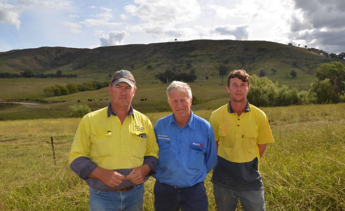 Mount View Orchards Batlow manager Ian Robson with Ross and Blake Smith, Adelong who may be potentially impacted by the new HumeLink routes.