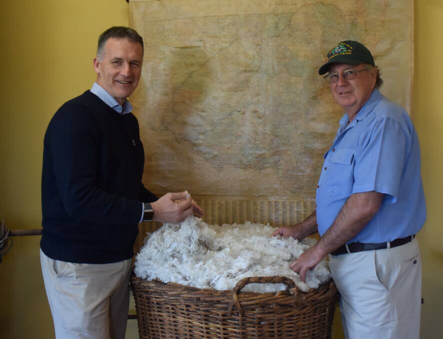 Australian Wool Exhange (AWEX) CEO Mark Grave with Gollan wool classer Rob Yeo. Photo: Taylor Jurd. 