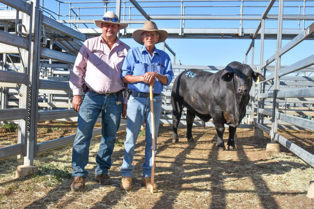 The $55,000 Brangus bull, Doonside 2787, with buyer Warren Miller, Hewitt Cattle Australia, and vendor Bill Geddes, Doonside, Rockhampton. Picture: Ben Harden 
