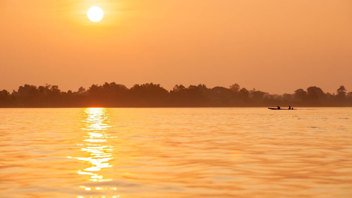 SUNSET: An Asian orange sunset on the Mekong Delta is something that can't be described, it can only be experienced.  Photo: Shutterstock.com