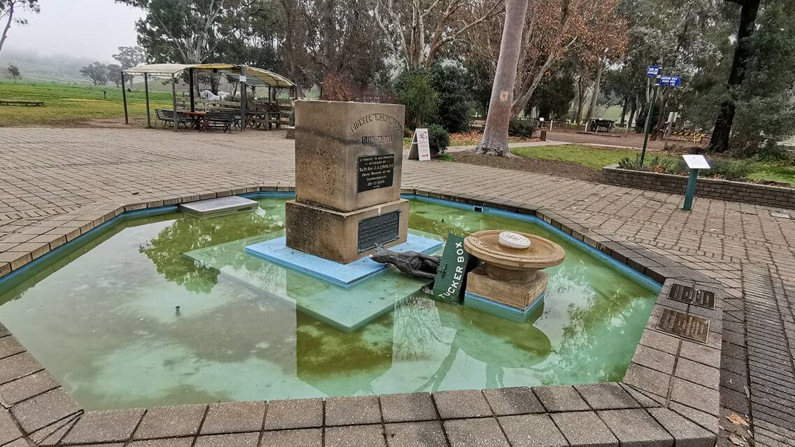 Knockout blow: The wishing well houses the dog and the tuckerbox after they were felled. Picture: LOST GUNDAGAI FACEBOOK