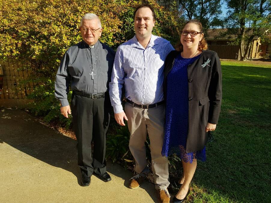 Contender: Labor candidate for Farrer Kieran Drabsch with Reverend Wayne Sheehan, of Deniliquin's St Paul's Anglican Church, and his fiancee Nadine Balnaves, who is also a teacher at Griffith High School.   