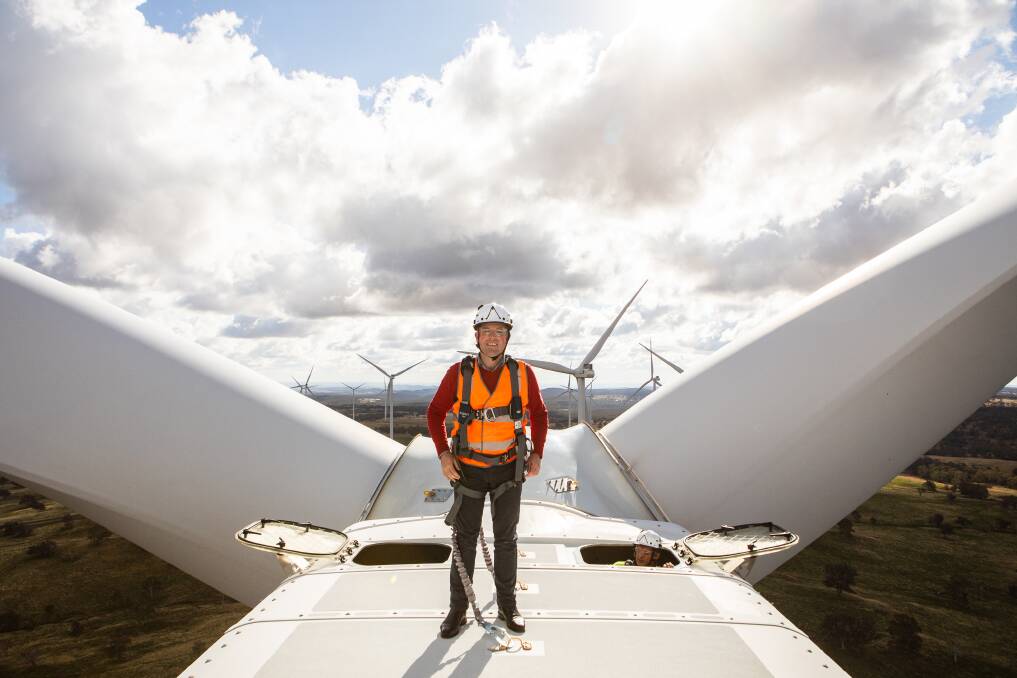 POWER UP: Adam Marshall (atop the Glen Innes Sapphire Wind Farm) has announced state government plans to unlock $12.7 billion in investment for renewable energy projects. Photo: supplied