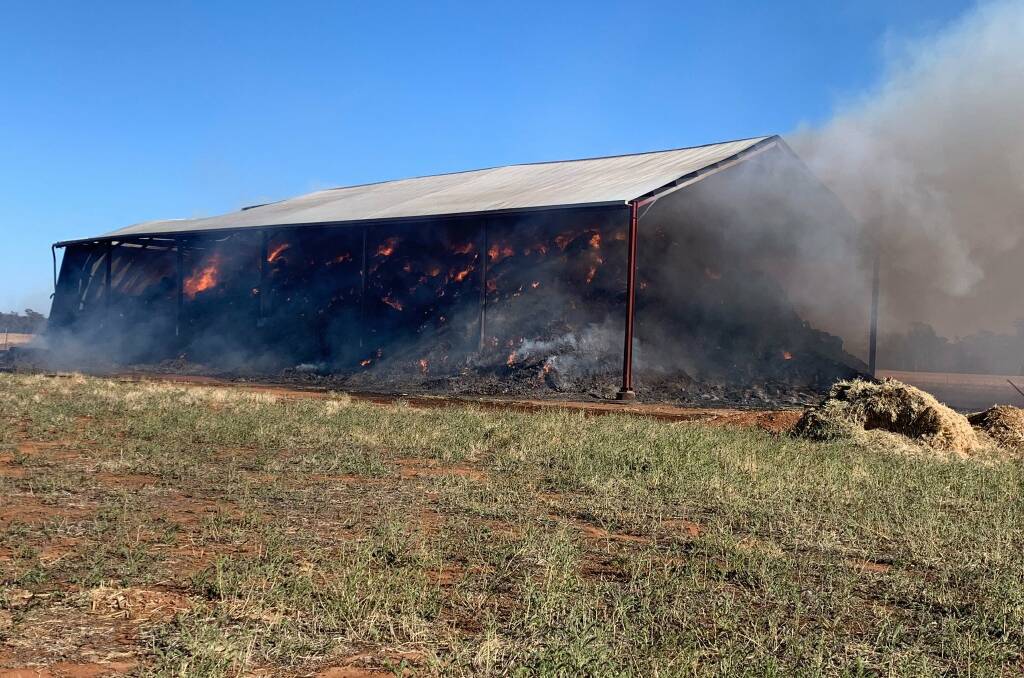 Fire overwhelms a stack of hay. Picture: NSW Rural Fire Service - Riverina Zone