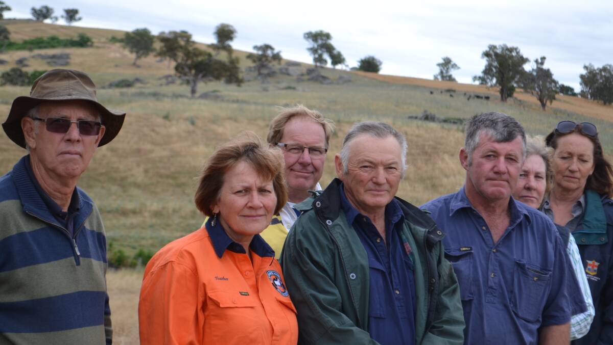 Former DPI agronomist Paul Parker, left with some of the Eulie neighbours who opposed the piggery. Judy McFadyen's husband Don is third from left. Eulie is in the background.