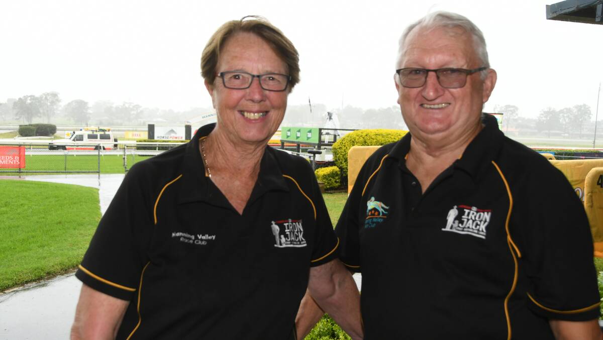 Chief executive Helen Sinclair and saddlecloth staffer Geoff Murray, ponder the gloomy conditions that saw half the Taree card abandoned. Photo Virginia Harvey. 