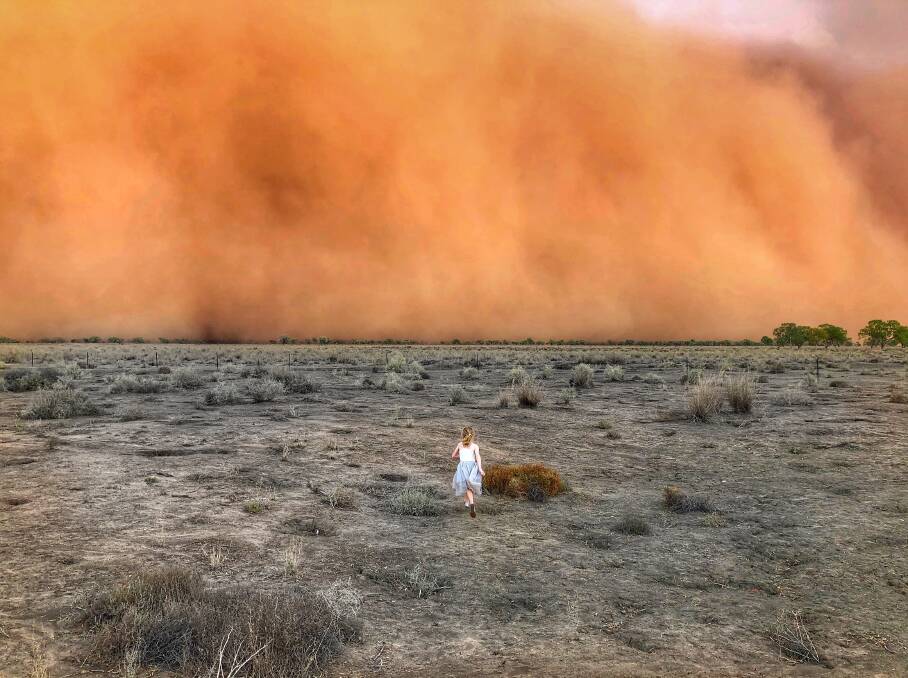 Marcia Macmillan's amazing photo of her daughter running into a dust storm east of Nyngan that went around the world - a media feeding frenzy that has shocked her. Photo: Marcia Macmillan.