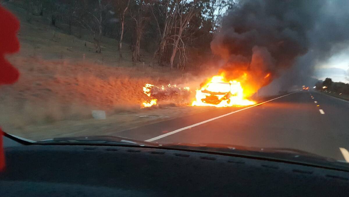 The car explodes in flames after hitting a kangaroo on the Monaro Highway.