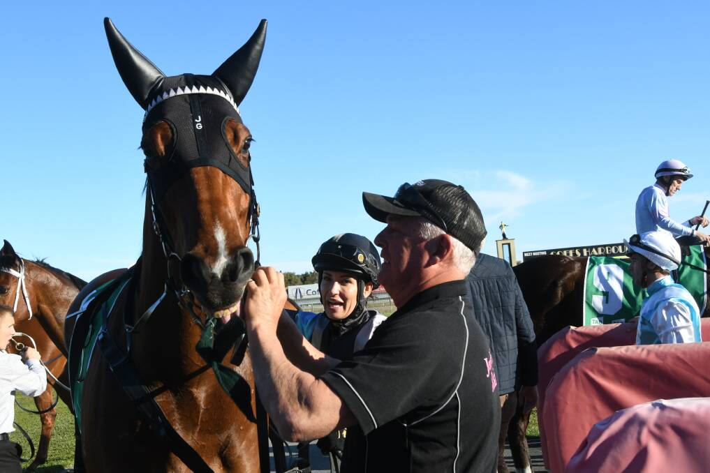  Port Macquarie-based Belinda Hodder unsaddling The Drake, with Jenny Graham stable's Shane Conroy, after winning the Showcase Sprint. Photo Virginia Harvey.
