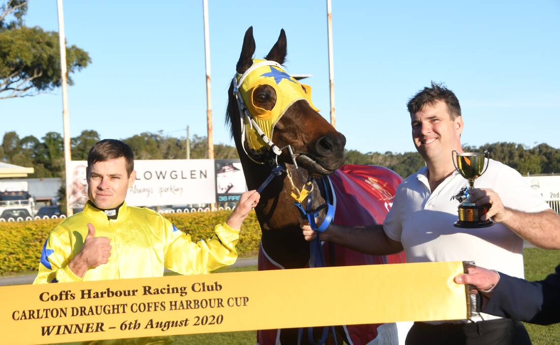  Winning jockey Aaron Bullock and Muswellbrook trainer Sam Kavanagh with Sikandarabad after win in the 2020 Carlton Draught Coffs Harbour Cup last Thursday. Photo Virginia Harvey. 