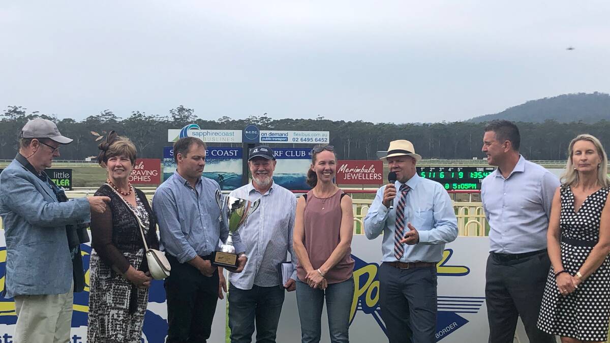 Sapphire Coast's secretary-manager Rob Tweedie presents the Bega Cup to winning trainer Theresa Bateup and connections after Monegal won the 2020 Cup. 