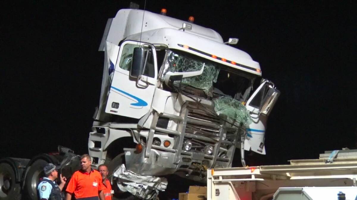 A truck taken from the crash site in which two people died and ten were injured north of Dubbo last week.