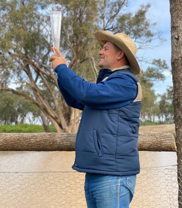 It rained across many areas of the state. Here farmer Peter Andrews, Tabratong, Nevertire, was more than happy to see 43mm in the home rain gauge after the recent rain. He even now has his own home lake. Photo by Mark Griggs.