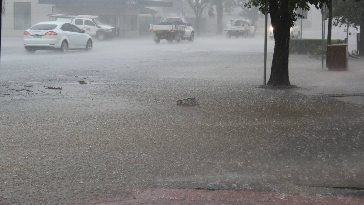 Rain smashes down in Balo Street in Moree with about 80mm dumped in one hour. Photo by Sophie Harris, Moree Champion.