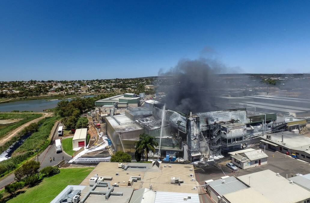 A fire keeps burning at Thomas Foods' meat processing plant at Murray Bridge after an accident in a basement sparked the fire, which has led to closure of the plant and more than 1000 workers facing an unknown future. Thomas has vowed to retain all staff through relocation. It may be able to keep some of the plant still running.