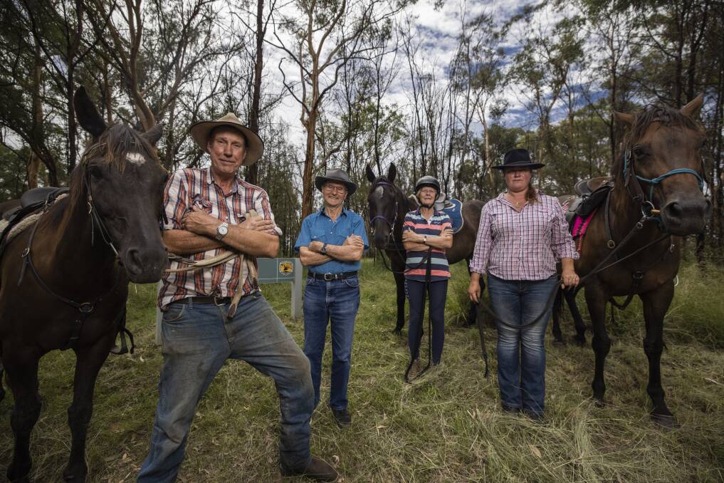 Brian Swan, Ron Males, Jo Arblaster, and Michelle Gibbs are angry at plans to limit the horse riding in Wollemi National Park. Photo: Simon Bennett