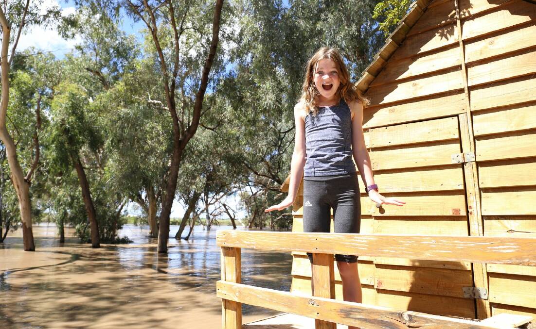 Harriet Poole suddenly had a water wonderland on the edge of her cubby house at Moree. Photo by Georgina Poole.