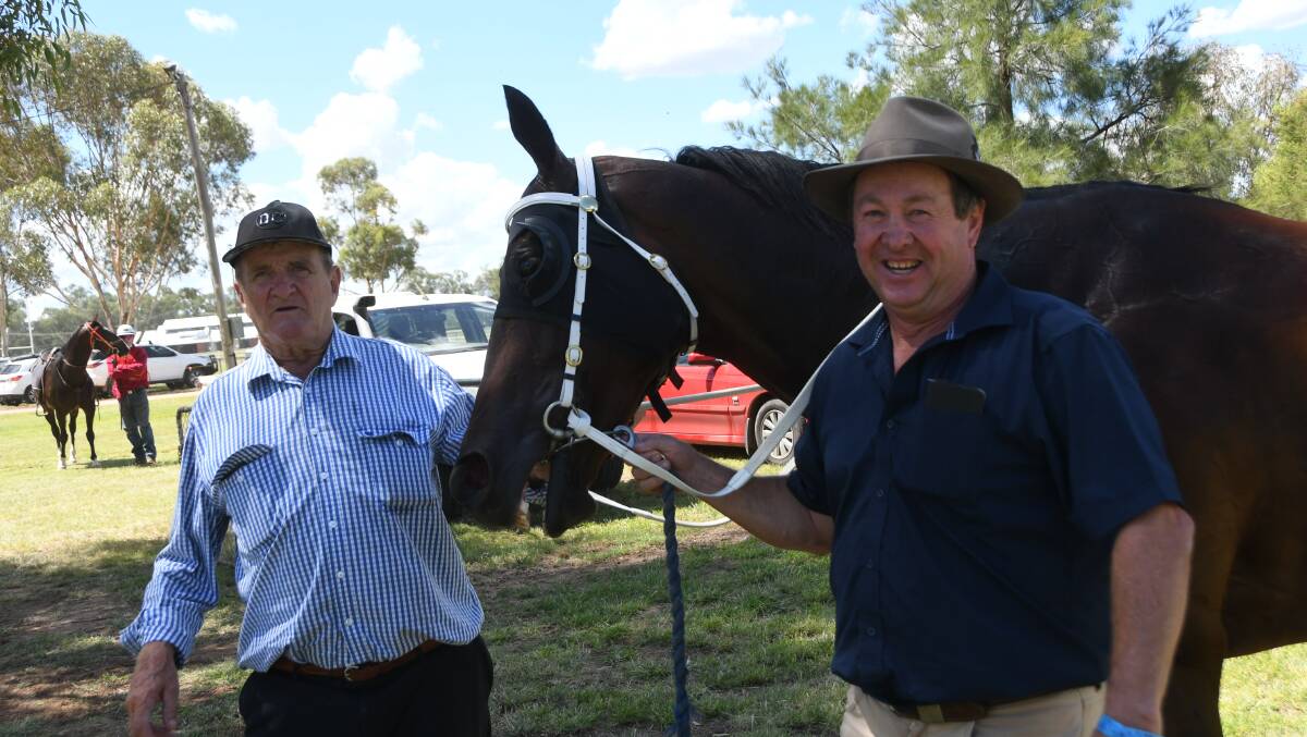 Nyngan conditioner Garry Bignell with his second winner Another Plan with strapper Craig Tyack from Tullibigeal at the Condobolin Picnics last Saturday. 