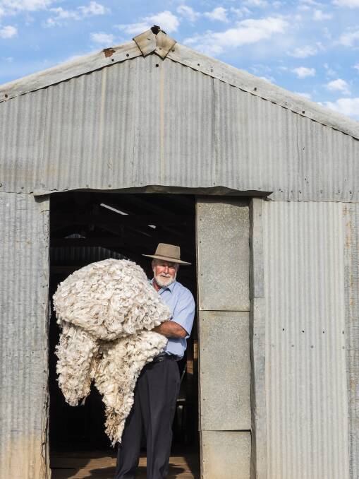 Ken Keith loading up the fine wool at his Parkes property. Photo: Denise Yates