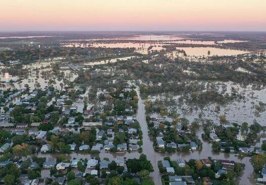 A land Down Under goes under. Moree in 2021 in a vast area of floodwater. Photo by Sascha Estens with a drone at 7am Thursday, Rabbithopfilms.