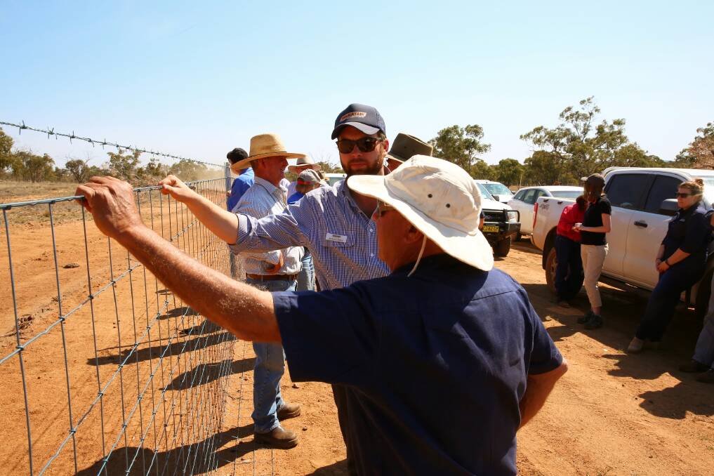 Touch test: about 100 farmers and guests gathered at Glenn Turner's "Penshurst" Gilgunnia to see the huge cluster exclusion fence put up by 16 landholders in the area covering more than 177,000 hectares.