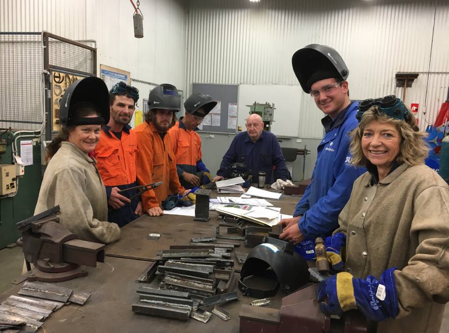 Course participants at Scone TAFE in a welding class conducted by respected teacher and farmer Stuart Murphy (centre), wth Merriwa farmer Annie Rodgers (at right).