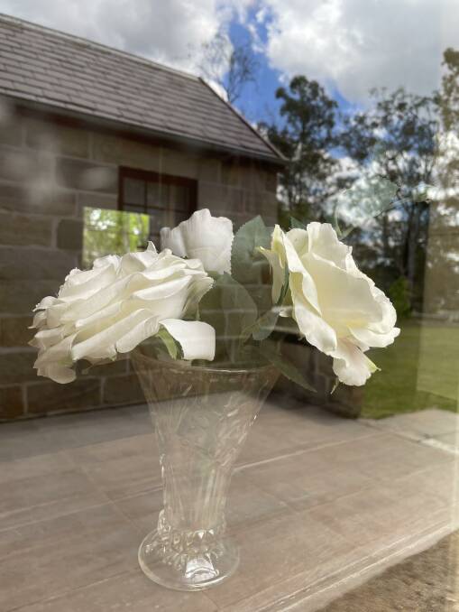 Roses in the window of the oldest church in Australia that still greets a small congregation. Photos by John Ellicott.