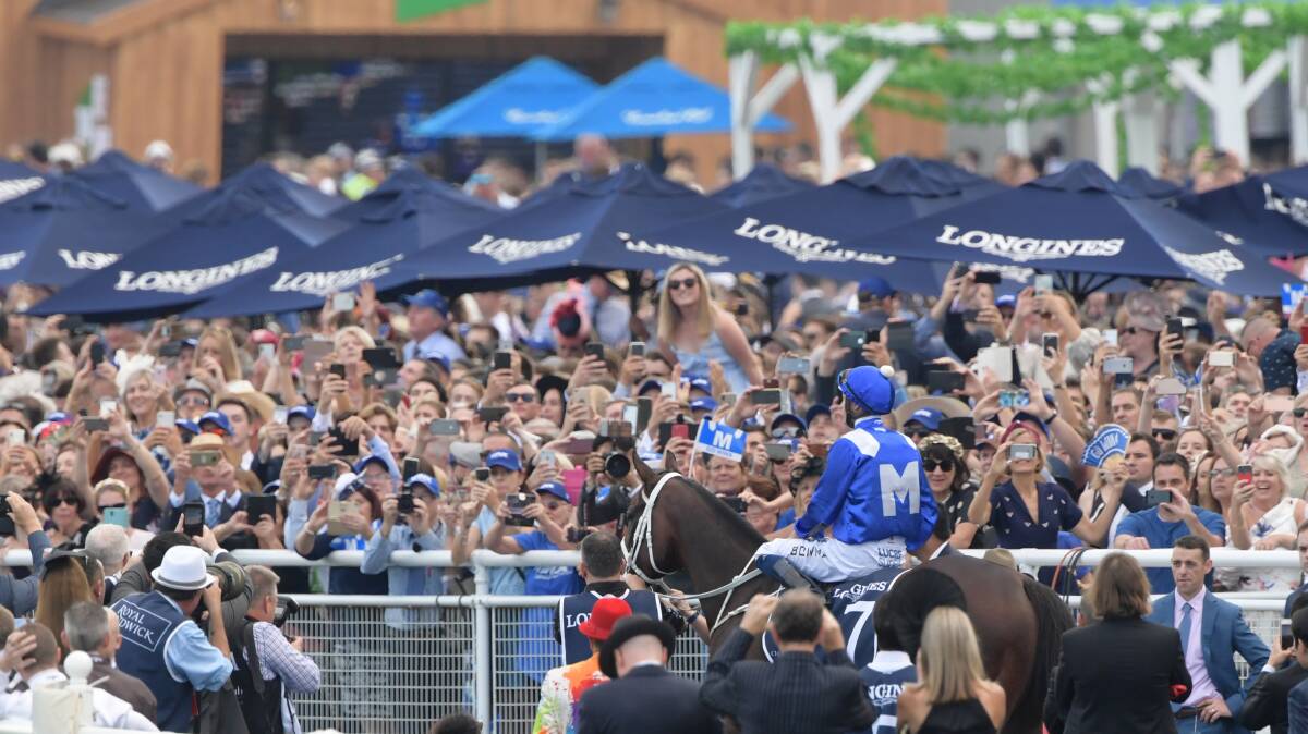 Winx accepts the cheers of the crowd after winning the Queen Elizabeth at Randwick, her last race start, and her 33rd win in a row.