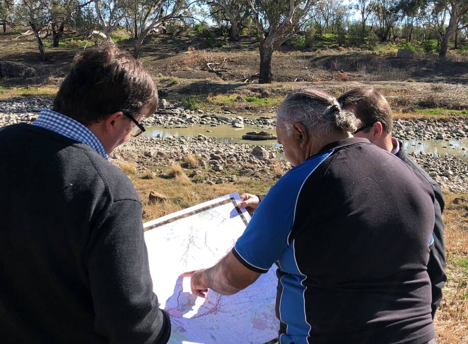 The maps are looked over at Brewarrina today after the hand over.