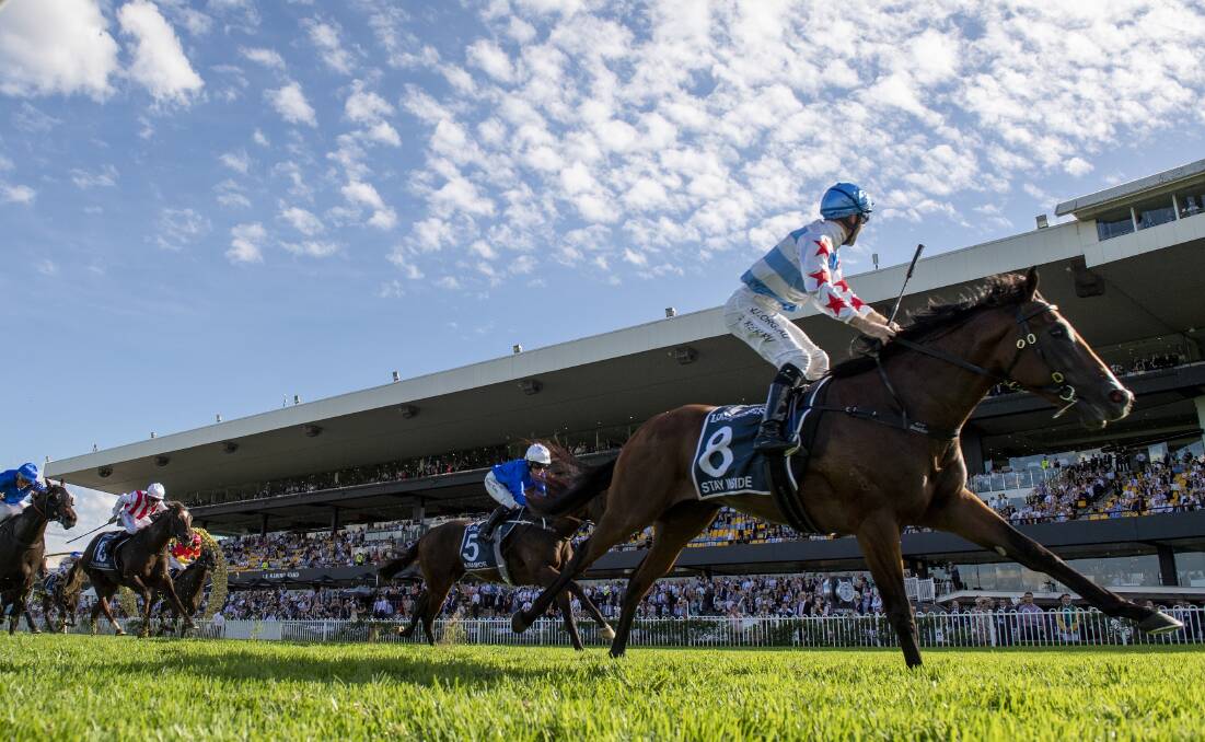 Stay Inside and jockey Tommy Berry take the world's richest race for juveniles, the Golden Slipper Stakes, at Rosehill last Saturday. Photo Steve Hart. 