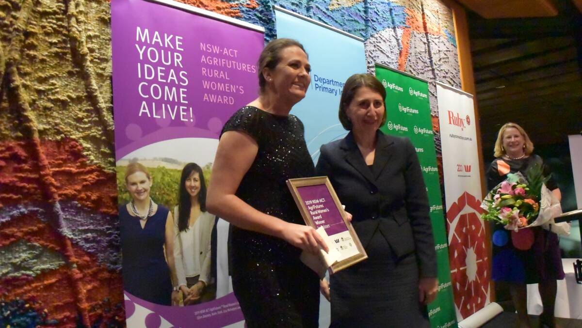 Jo Palmer receives her award as the Agrifutures NSW-ACT Rural Woman of the Year from NSW Premier Gladys Berejiklian.
