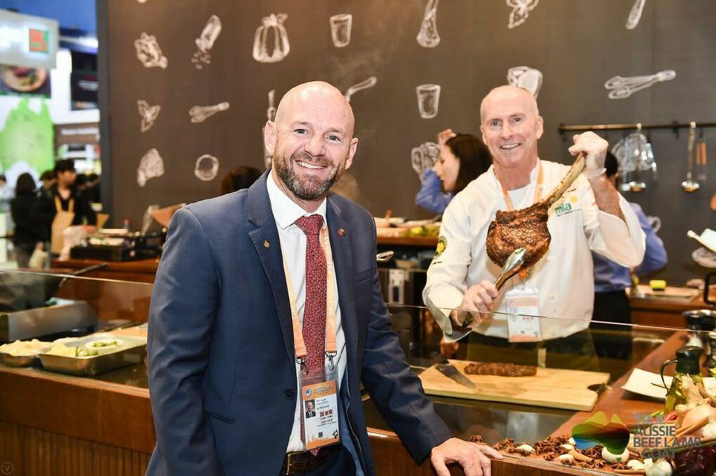 Niall Blair at the Meat and Livestock Australia stand at the huge import export expo in Shanghai where people queued to taste some Aussie beef.