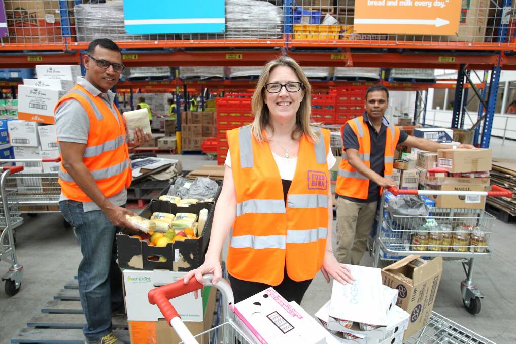 Essential food packages are put together at Foodbank's Sydney headquarters.
