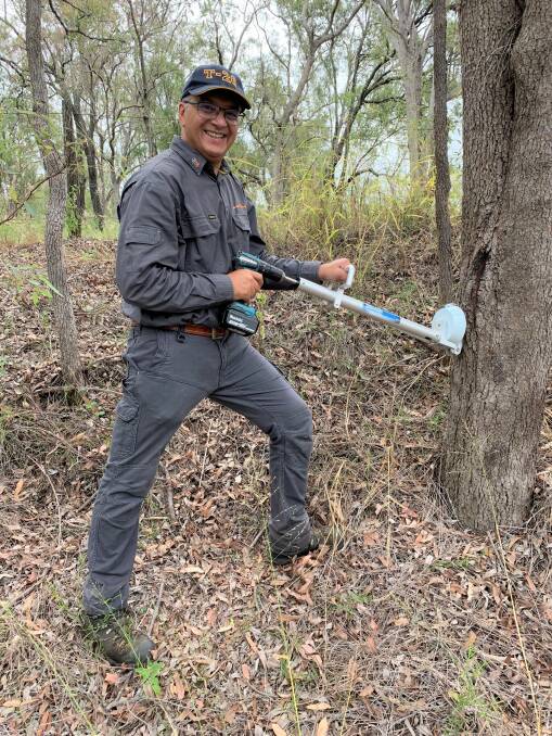Professor Vic Galea with the new Injecta gun that can kill large invasive trees.