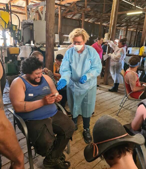 Shearing shed turned into a corona vaccine clinic at Bangate Station as the Royal Flying Doctor Service gave some Pfizer vaccine shots to shearers while the shed was underway. Photo courtesy of Muddy's Quality Shearing.