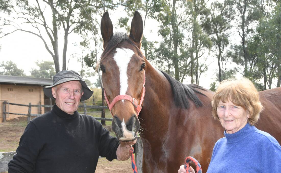 Klaus and Ethne Potowski at their Wilberforce district property Strathdue with galloper Happy Hustler. Photo Virginia Harvey.