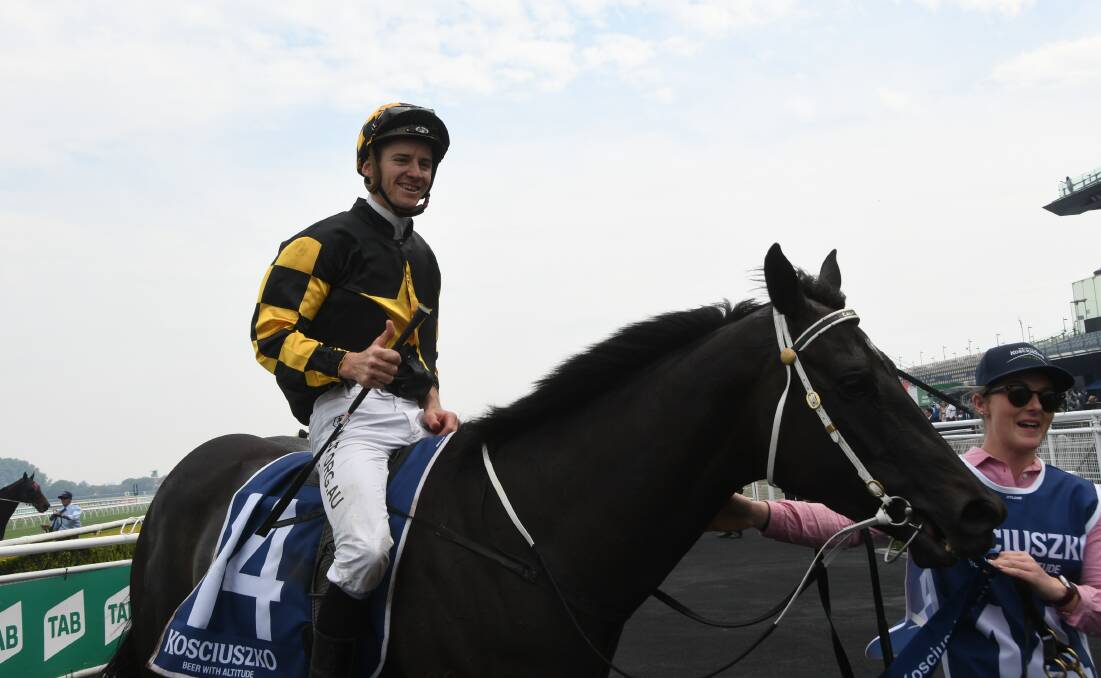  A happy Jason Collett brings Its Me back to scale after winning The Kosciuszko (with handler Rowena Dillon) at Randwick last Saturday. Photo Virginia Harvey 