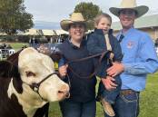 HAPPY FAMILY: Brittany and Brandon Sykes, with Carter, 2, Mawarra B, Koetong, with Mawarra B Show Stopper which won the junior division. The Sykes family won most successful exhibitor.