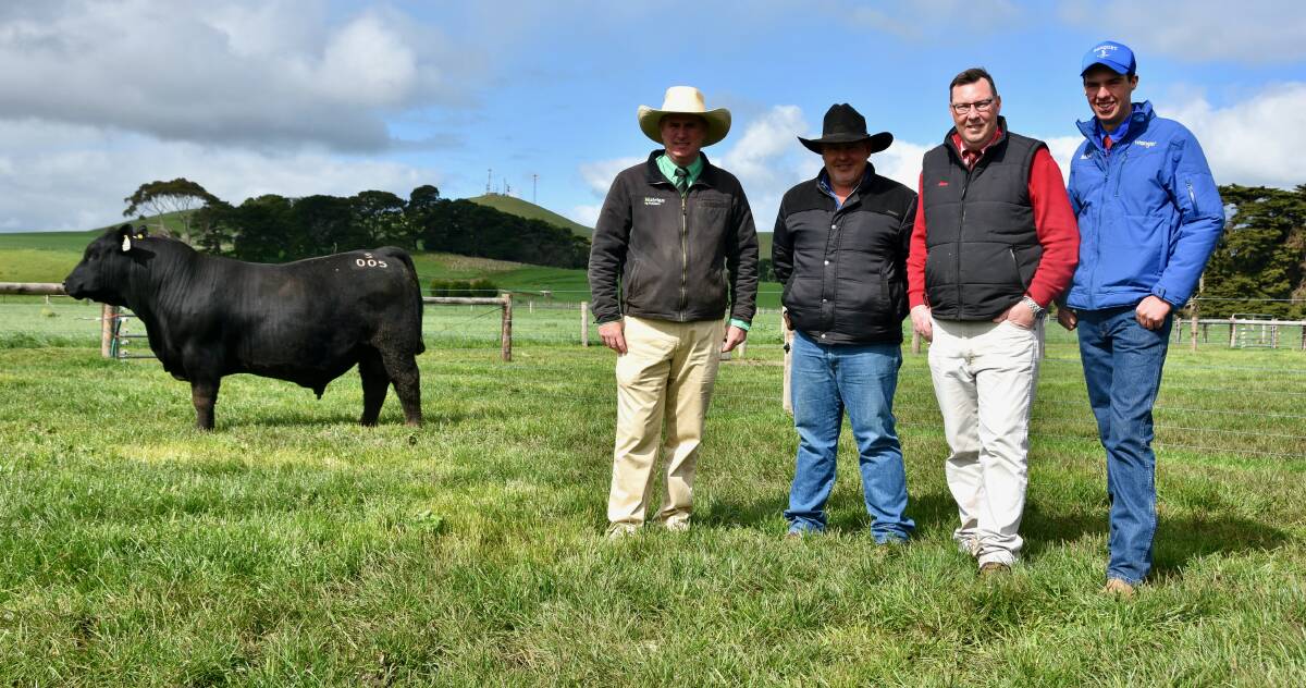 Nutrien south-east stud stock manager Peter Godbolt, Ian Durkin, Mountain Valley stud, Coolatai, NSW, Elders Victoria and Riverina stud stock manager Ross Milne, and Hamish Branson, Banquet Angus, with the $65,000 Banquet bull, Banquet Sensation S005.