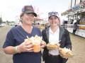 GOOD GRUB: Sarah and Maddie Coombes enjoying the carnival-style food at the Barraba Show on Sunday. Photo: Peter Hardin