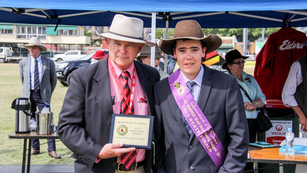 Blake Munro, Elders, Toowoomba, presents Joe Tones with the state champion stud young judge award at the 2017 Ekka. Picture: Lucy Kinbacher