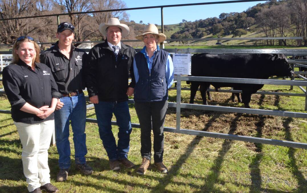 Jess Reynolds and Sam Lucas of Reiland Angus with Michael Glasser, GTSM, and top price bull buyer, Jo-Ann Strong, Tiana Park, Jugiong.