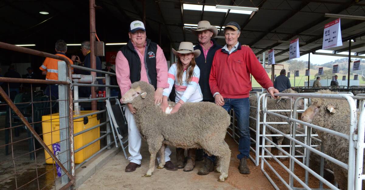 Tim McKean, Elders Wagga, Matilda and Paul Graham, Adjungbilly and Ron Blyth, Blyth Merinos with the top price ram. 