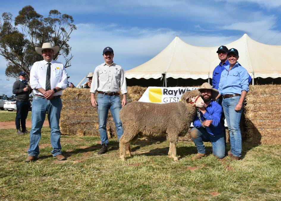The $5500 top-priced ram with James Brown, Ray White GTSM, buyer Jack Dodds and vendors Tom, Andrew and Jodie Green, Aloeburn Poll Merinos, Boree Creek. 