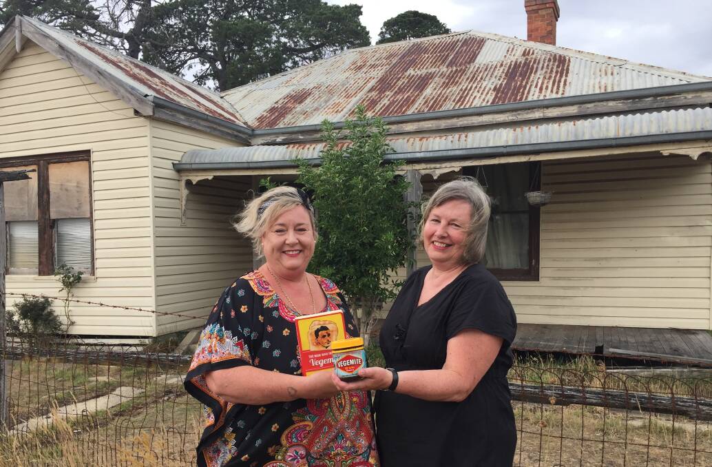 Beaufort Progress Association members Liza Robinson and Sarah Beaumont with the iconic product outside the first home of it's inventor. 